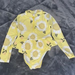 Carter’s 5T/5A ruffle one piece yellow flowered swimsuit. Like new! Rarely worn